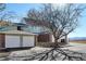 Charming townhouse with brick accents, an attached two-car garage, and well-maintained landscaping at 2030 Gyros Cir # 155, Lafayette, CO 80026