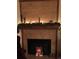 Close up of a fireplace adorned with festive garland, lights and decorations at 2030 Gyros Cir # 155, Lafayette, CO 80026