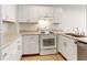 Kitchen with white cabinets and appliances at 2030 Gyros Cir # 155, Lafayette, CO 80026