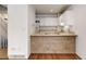 Kitchen with wood-look breakfast bar at 2030 Gyros Cir # 155, Lafayette, CO 80026