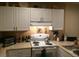 Kitchen with white appliances and ample storage at 2030 Gyros Cir # 155, Lafayette, CO 80026