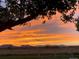 Beautiful sunset view from the property, featuring orange and purple hues over the mountains at 2030 Gyros Cir # 155, Lafayette, CO 80026