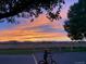 Scenic sunset with a on a bicycle in the foreground at 2030 Gyros Cir # 155, Lafayette, CO 80026