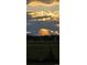 Majestic sunset light peeking through the clouds, creating a dramatic and appealing vista from the property at 2030 Gyros Cir # 155, Lafayette, CO 80026