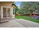 Spacious backyard featuring lush lawn, mature trees, and relaxing hot tub at 5926 S Elkhart Ct, Centennial, CO 80016