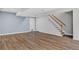 Finished basement with staircase and two white doors at 5926 S Elkhart Ct, Centennial, CO 80016