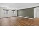 Finished basement with wood-look floors, neutral walls and windows at 5926 S Elkhart Ct, Centennial, CO 80016
