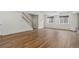 Large finished basement with wood-look floors and staircase at 5926 S Elkhart Ct, Centennial, CO 80016