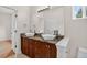Bathroom featuring double sinks with modern fixtures, a large mirror, and stylish vanity at 5926 S Elkhart Ct, Centennial, CO 80016