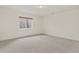 Neutral bedroom featuring carpet and a window, offering a serene and comfortable space at 5926 S Elkhart Ct, Centennial, CO 80016