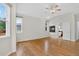 Spacious bedroom with hardwood floors, ceiling fan, and ensuite bathroom access at 5926 S Elkhart Ct, Centennial, CO 80016