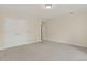 Carpeted bedroom with a large closet and doorway, providing ample storage and easy access at 5926 S Elkhart Ct, Centennial, CO 80016