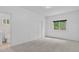 Bedroom with neutral carpet, a window with a view, and a closet; simplistic and bright at 5926 S Elkhart Ct, Centennial, CO 80016