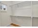 Walk-in closet with hanging rods and shelving, offering ample storage and organization at 5926 S Elkhart Ct, Centennial, CO 80016