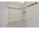 Walk-in closet offering ample storage space with shelving, rods, and added hooks at 5926 S Elkhart Ct, Centennial, CO 80016