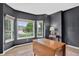 Bright living room showcasing large windows and dark gray accent wall at 5926 S Elkhart Ct, Centennial, CO 80016