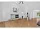 Spacious living room with hardwood floors, a fireplace, high ceilings, and lots of natural light, creating an airy atmosphere at 5926 S Elkhart Ct, Centennial, CO 80016