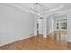 Bright living room featuring hardwood floors and an arched entryway at 5926 S Elkhart Ct, Centennial, CO 80016