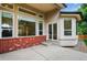 Outdoor patio area with brick accents and large windows providing natural light and scenic views at 5926 S Elkhart Ct, Centennial, CO 80016