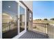 View from the balcony of the neighborhood with sliding glass doors providing access to the home at 22072 E 38Th Pl, Aurora, CO 80019