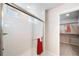 Bathroom featuring a glass-door shower with white subway tile, and doorway to the closet at 22072 E 38Th Pl, Aurora, CO 80019