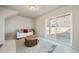 Cozy living room with a sofa, area rug, and sliding glass doors to the backyard at 22072 E 38Th Pl, Aurora, CO 80019