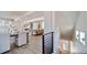 Living and dining areas with modern decor, staircase, and plenty of natural light at 22072 E 38Th Pl, Aurora, CO 80019