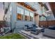 Cozy back patio with stylish outdoor seating and string lights at 5735 Boston St, Denver, CO 80238