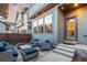 Charming back patio area with string lights and comfortable outdoor furniture at 5735 Boston St, Denver, CO 80238