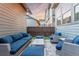 Relaxing back patio with cushioned seating, perfect for outdoor lounging at 5735 Boston St, Denver, CO 80238