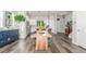 Open-concept dining and kitchen area with hardwood floors and contemporary design at 5735 Boston St, Denver, CO 80238