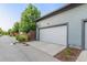 View of a spacious two-car garage featuring well-maintained doors and an accessible driveway at 5735 Boston St, Denver, CO 80238