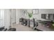 Functional home office space with desk, shelving, and ergonomic chair at 5735 Boston St, Denver, CO 80238