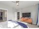 Bright, airy bedroom with walk-in closet, TV, and comfortable furnishings at 5735 Boston St, Denver, CO 80238
