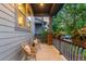 Cozy porch with seating offers a relaxing outdoor space with views of the neighborhood at 5735 Boston St, Denver, CO 80238