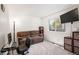 Cozy bedroom featuring a brown couch, desk, and window offering ample natural light at 1387 Mcintosh Ave, Broomfield, CO 80020
