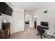 Well-lit bedroom featuring a view of the hallway and white closet doors at 1387 Mcintosh Ave, Broomfield, CO 80020