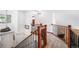 Inviting foyer featuring hardwood floors, staircase, and decorative accents at 1387 Mcintosh Ave, Broomfield, CO 80020