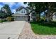 Charming two-story home with a well-maintained lawn, large tree and a driveway with a basketball hoop at 1387 Mcintosh Ave, Broomfield, CO 80020