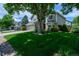 Charming two-story home with a well-manicured lawn and mature trees providing curb appeal at 1387 Mcintosh Ave, Broomfield, CO 80020