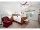 Spacious primary bedroom with vaulted ceilings, a cozy chair, and plenty of natural light at 1387 Mcintosh Ave, Broomfield, CO 80020