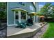 Back patio with outdoor seating, grill, and umbrella for relaxation and entertainment at 1387 Mcintosh Ave, Broomfield, CO 80020