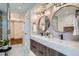 Elegant bathroom showcasing dual sinks, marble countertops and modern fixtures at 2599 S Cherokee St, Denver, CO 80223