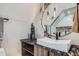Sleek bathroom showcasing a vessel sink, unique lighting, and stylish granite countertops at 2599 S Cherokee St, Denver, CO 80223
