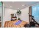 Bright exercise room features wood floors, natural light, and modern exercise equipment at 2599 S Cherokee St, Denver, CO 80223