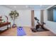 Bright exercise room with wood floors and space for fitness equipment at 2599 S Cherokee St, Denver, CO 80223