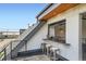 Rooftop deck with a wet bar, seating area, and scenic city views at 2599 S Cherokee St, Denver, CO 80223