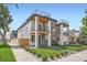 Contemporary home boasts multi-level outdoor decks and modern design with stone accents and manicured landscaping at 2599 S Cherokee St, Denver, CO 80223
