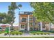 Modern home with stone and siding accents, manicured landscaping, and a 'For Sale' sign at 2599 S Cherokee St, Denver, CO 80223