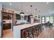 Beautiful open concept kitchen featuring a large island and modern appliances with ample cabinet space at 2599 S Cherokee St, Denver, CO 80223